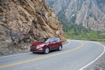 2014 Hyundai Santa Fe Sport in Serrano Red - Driving Front Left Three-quarter View